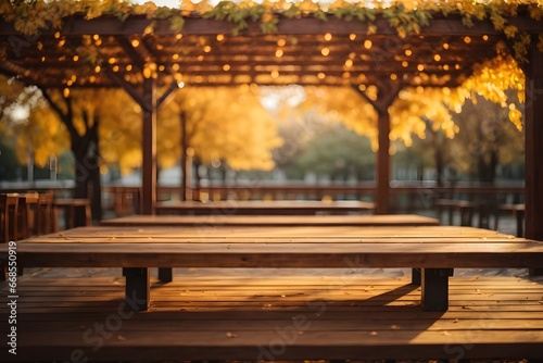 Empty wooden table top with illuminated wooden pergola in park background with bokeh autumn sunlight. Generative Ai.