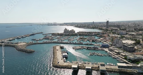 Aerial view of the Limassol Marina, Cyprus. A port in a cityscape on the shore of the Mediterranean Sea with luxury yachts for leisure. High quality 4k footage photo