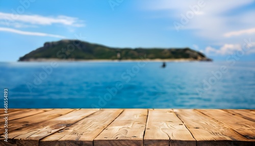 empty wooden table over the sea, wooden table on the background of the sea, island and the blue sky, blurred background