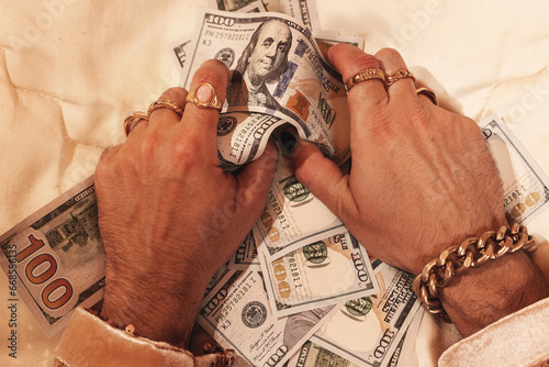 Obraz na płótnie Hands of a wealthy man, adorned with golden rings and a striking black manicure