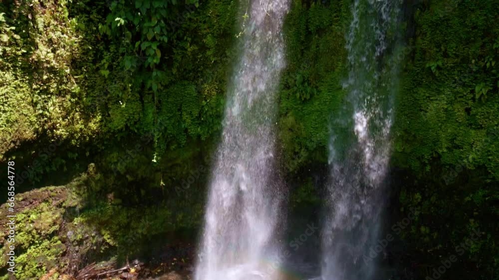 Panning Up Revealing Togonan Falls near Mainit In Tropical Jungle in the Philippines Panning Up Revealing Togonan Falls near Mainit In Tropical Jungle in the Philippines