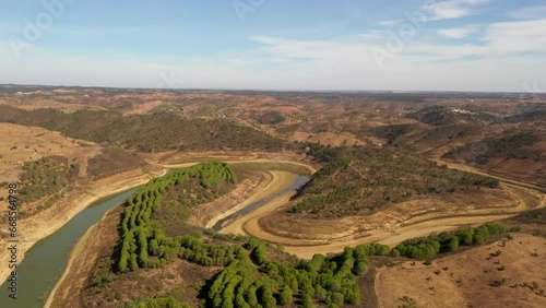 Winding Course Of Mira River Through The Hills In Ourique, Portugal. - aerial photo