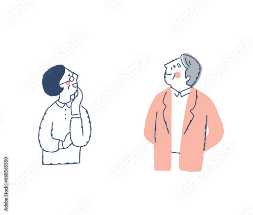 上の方を見ながら喜ぶシニアカップル