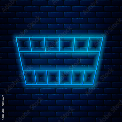 Glowing neon line Sauna bucket icon isolated on brick wall background. Vector
