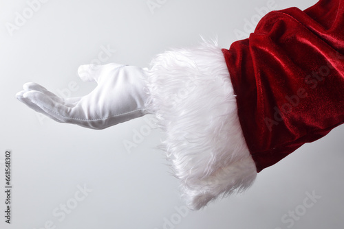 Santa claus hand making gesture offering isolated white