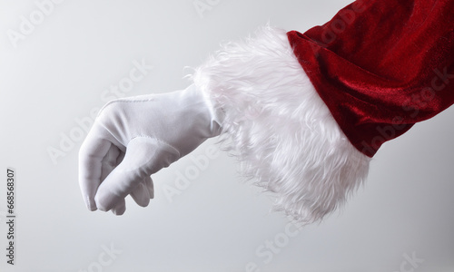 Santa claus hand making gesture of catching something isolated white photo