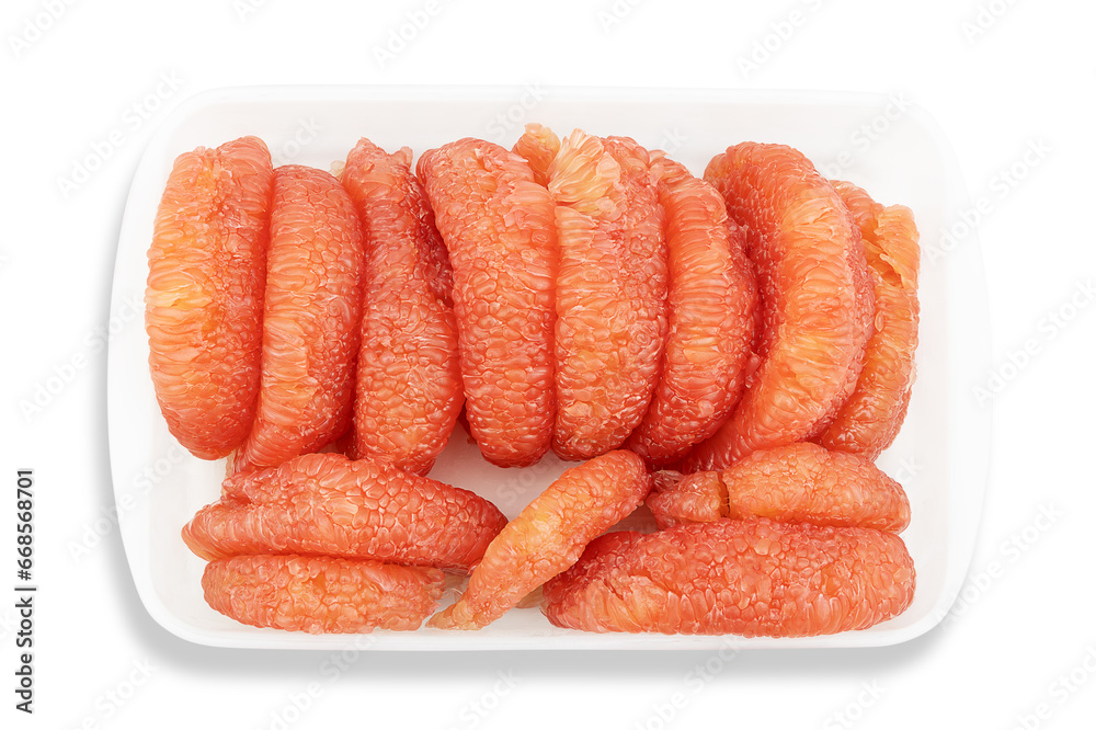 Fresh pealed pomelo fruit on white plastic tray with clipping path, top view Fresh pealed pomelo fruit on white plastic tray with clipping path, top view