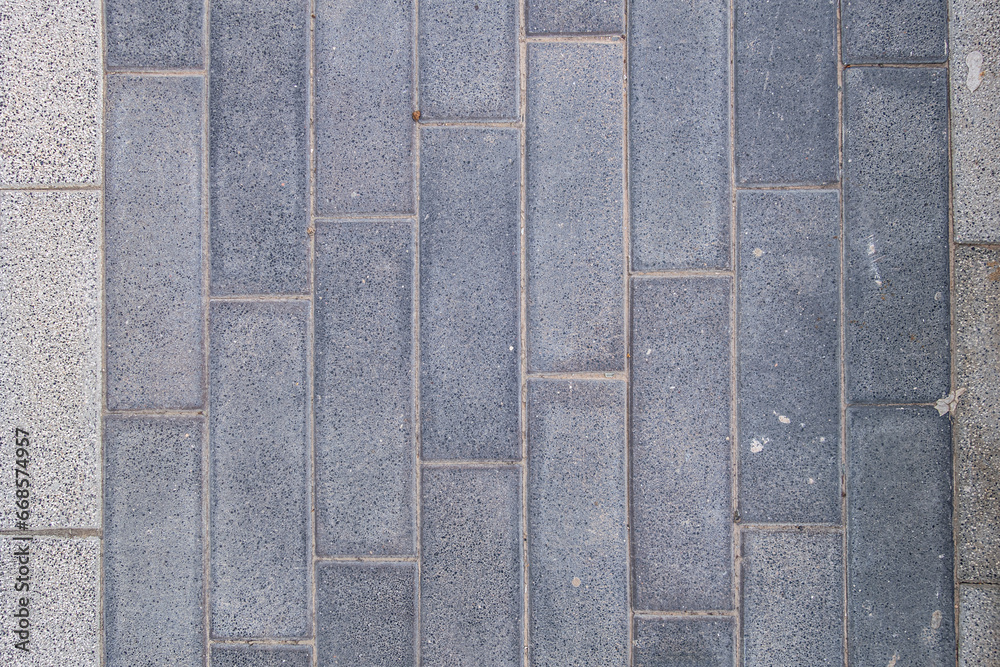 Fototapeta premium abstract background of grey tiles on the track in the park