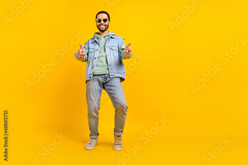 Full body length photo cadre of cool funky hipster man wear sunglass direct fingers you dude invitation isolated on yellow color background