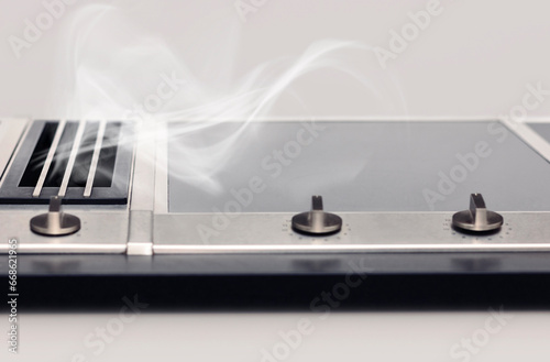 Cooktop Extractor Fan, Modern Induction Cooker, Stove top, Integrated Extractor Hood, Build-in Exhaust Fan with Smoke.