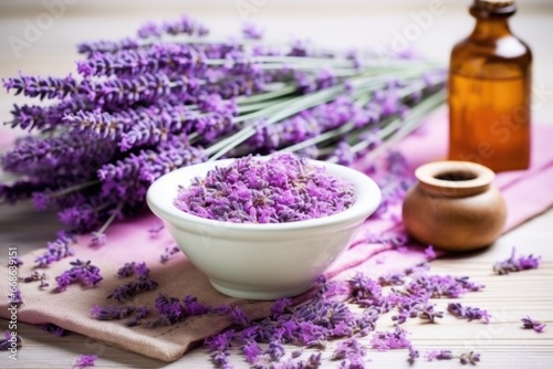 lavender bunch next to a ceramic bowl filled with dried lavender for tea
