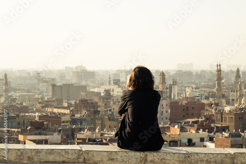 Woman enjoying the view of the panoramic city of Cairo, Egypt.