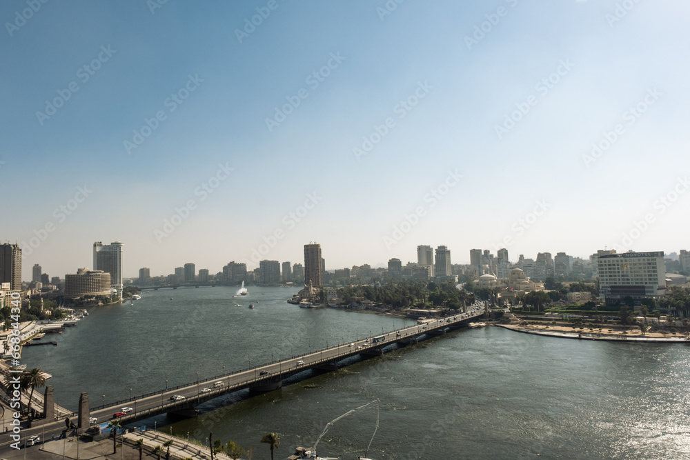 Aerial view of the city of Cairo, the Nile river and the bridge. Towers over the cityscape of this african metropolis.