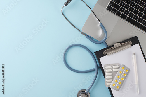 Embrace the convenience of virtual healthcare appointments. Top view photo of laptop, stethoscope, clipboard, pen, drugs on light blue background with promo zone