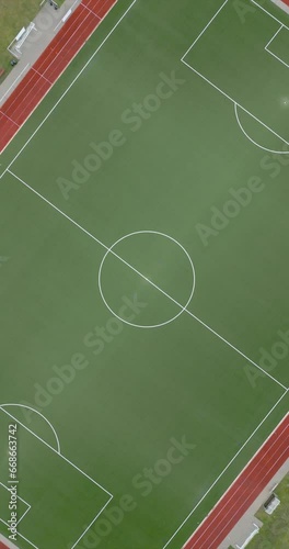 4k 60fps drone footage of an empty soccer field spinning