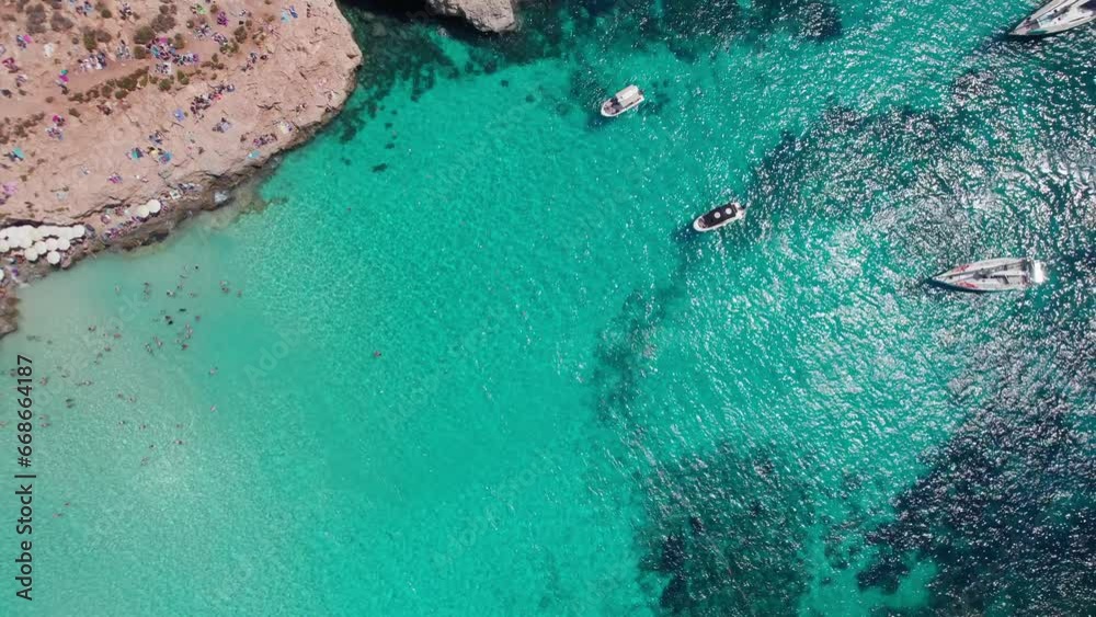 Aerial panoramic drone footage of Pure crystal water of the famous Blue Lagoon on the Maltese Island of Comino, Malta