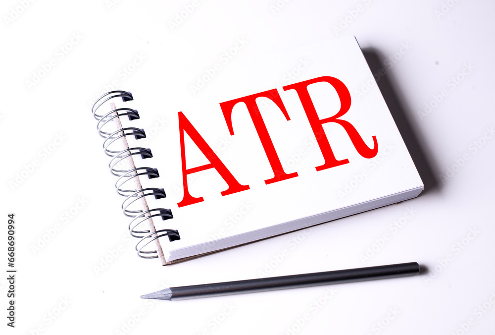Text ATR Average True Range on notebook on the white background Text ATR Average True Range on notebook on the white background