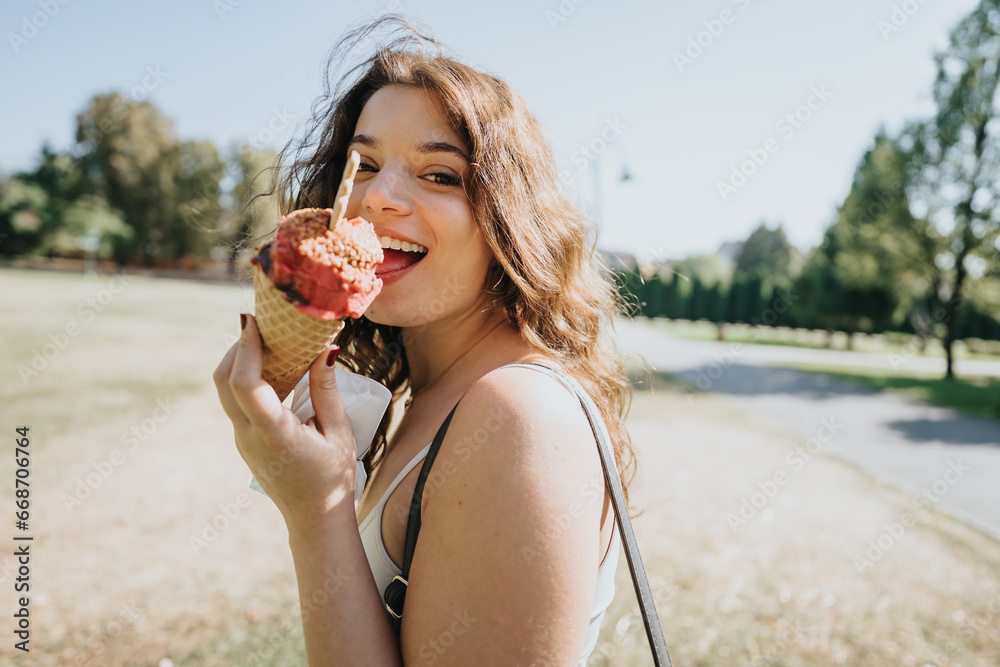 Joyful friends in a city park enjoying a carefree day off. They chat, relax and eat ice cream in a green environment, embracing the freedom of leisure time together. Joyful friends in a city park enjoying a carefree day off. They chat, relax and eat ice cream in a green environment, embracing the freedom of leisure time together.