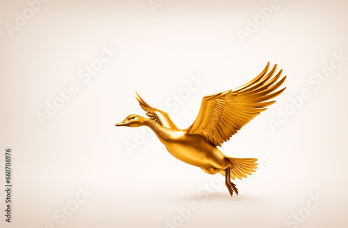 Flying golden goose with copy space photo