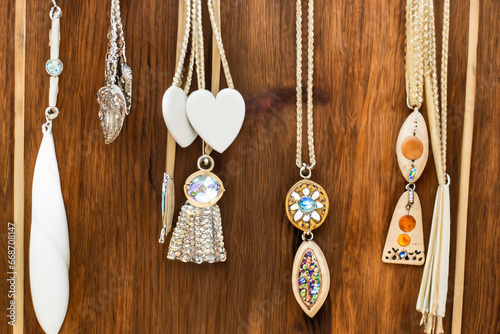 Handmade Jewelry Hanging from Rustic Wood