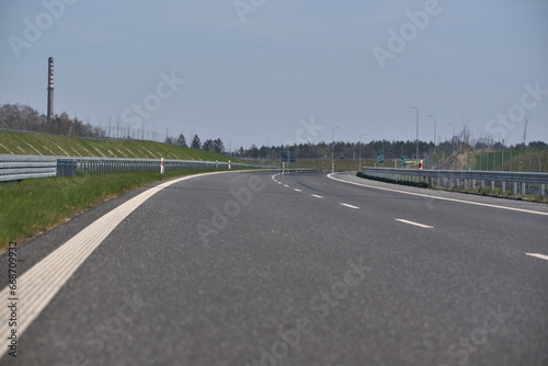 empty highway, visible barriers and road lanes