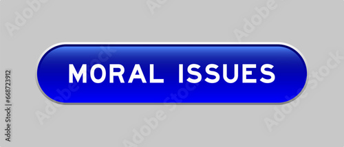 Blue color capsule shape button with word moral issues on gray background