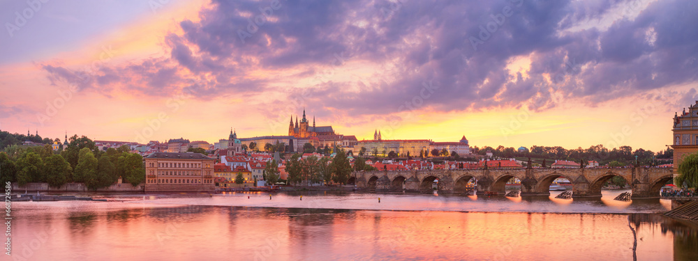 City summer landscape at sunset, panorama, banner - view of the Charles Bridge and castle complex Prague Castle in the historical center of Prague, Czech Republic - obrazy, fototapety, plakaty 