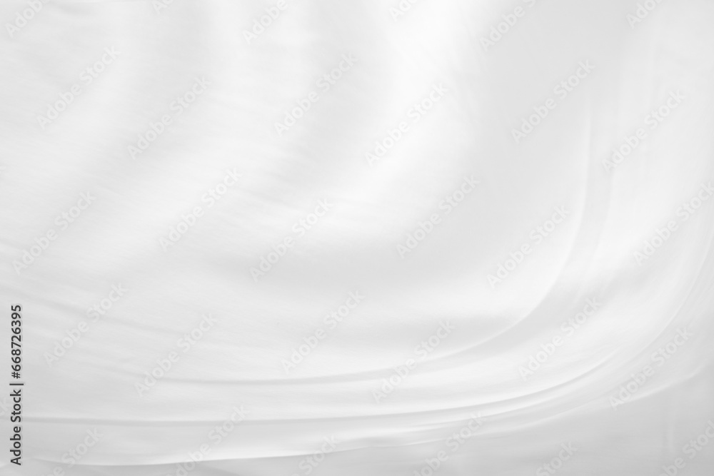White cloth background abstract with soft waves.Abstract White Bedding Sheets or White wrinkled fabric background texture and Texture with copy-space :Creased or wrinkled white fabric,Soft focus