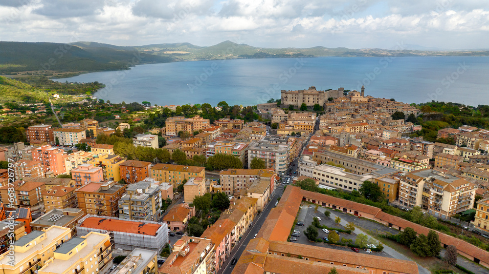 Obraz premium Aerial view of Bracciano, in the metropolitan city of Rome, Italy. The town is located on the shores of Lake Bracciano. In the historic center there is the castle and cathedral of Santo Stefano.