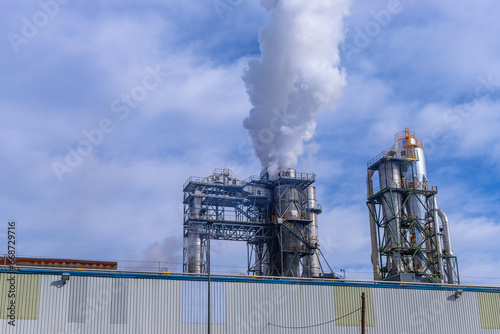 Smokestacks in a paper mill photo