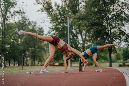 Fit sisters perform breathtaking 360-degree flips and cartwheels outdoors, showcasing their flexibility and strength. Inspiring active lifestyle and sport in nature.