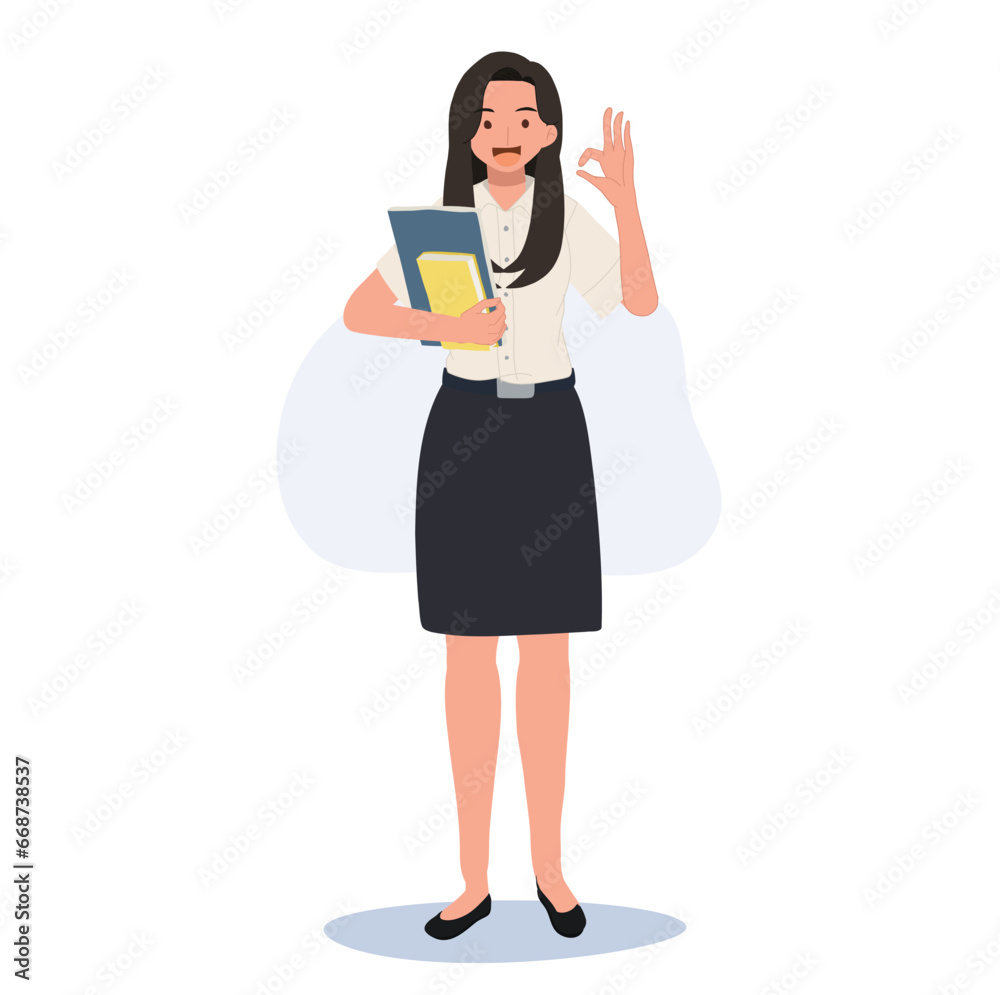 Thai University Student in Uniform Holding Books and doing OK hand sign gesture Thai University Student in Uniform Holding Books and doing OK hand sign gesture