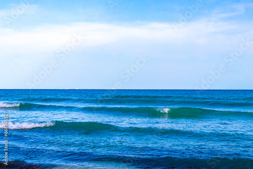 Waves at tropical beach caribbean sea clear turquoise water Mexico.