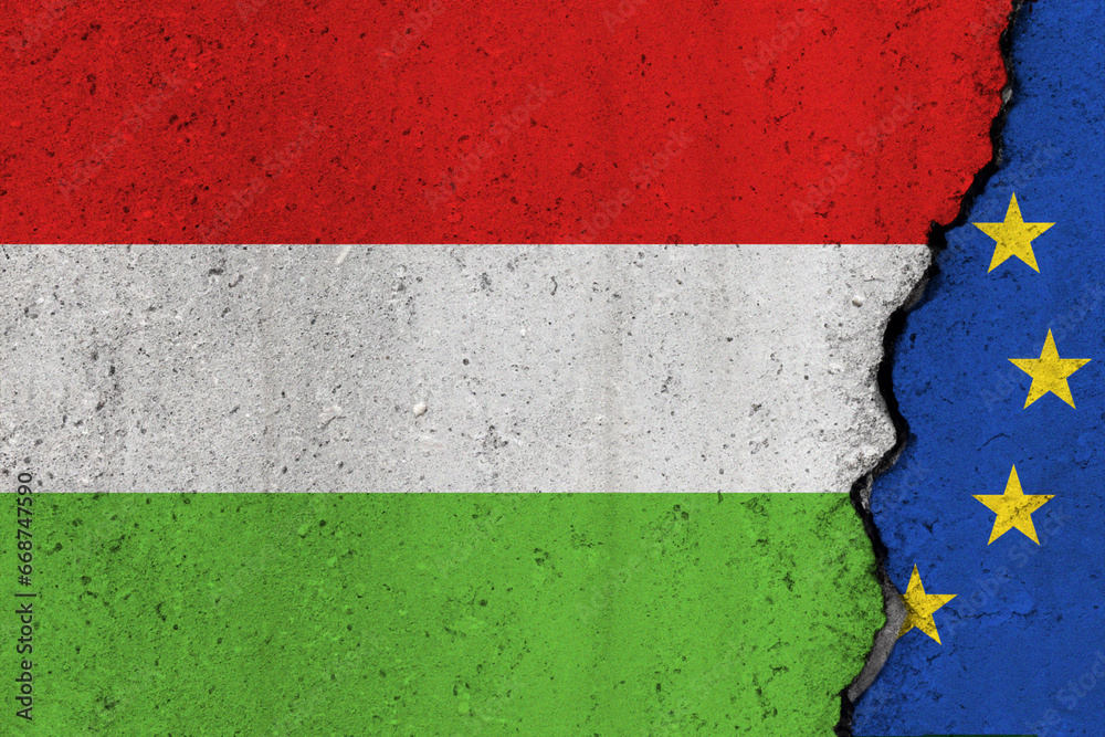 Hungary and EU flag cracked on a concrete background Hungary and EU flag cracked on a concrete background
