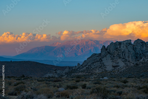Cloudy morning in the Buttermilks  at the foothills of the Sierra Nevada Mountains in Bishop California. Fall colors and snow capped mountains with large clouds.