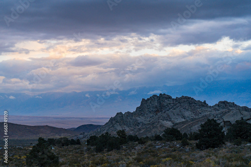 Cloudy morning in the Buttermilks, at the foothills of the Sierra Nevada Mountains in Bishop California. Fall colors and snow capped mountains with large clouds.