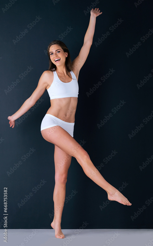 Happy woman, portrait and body in underwear for weight loss, healthy diet or fitness against a studio background. Attractive female person or model smile in slim, lean figure or health and wellness