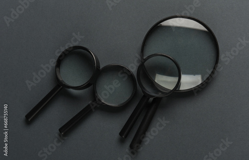 Magnifiers on dark gray background. Top view
