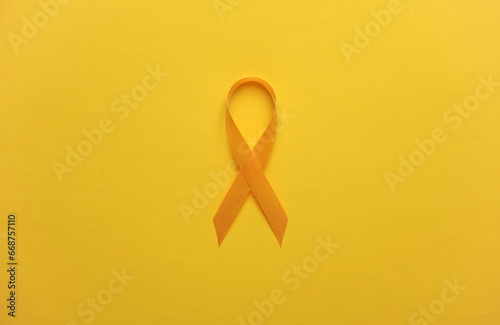 Yellow ribbon, childhood cancer awareness day symbol photo