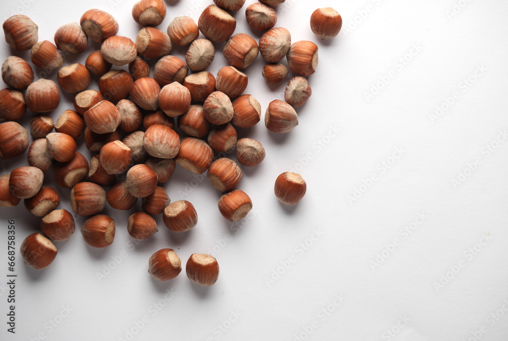 Hazelnuts on a white background. Top view. Copy space Hazelnuts on a white background. Top view. Copy space