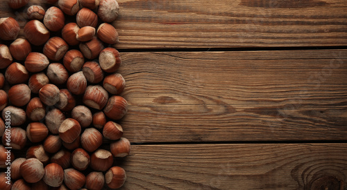 Hazelnuts on a wooden table. Top view. Copy space