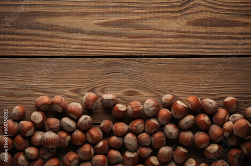 Hazelnuts on a wooden table. Top view. Copy space