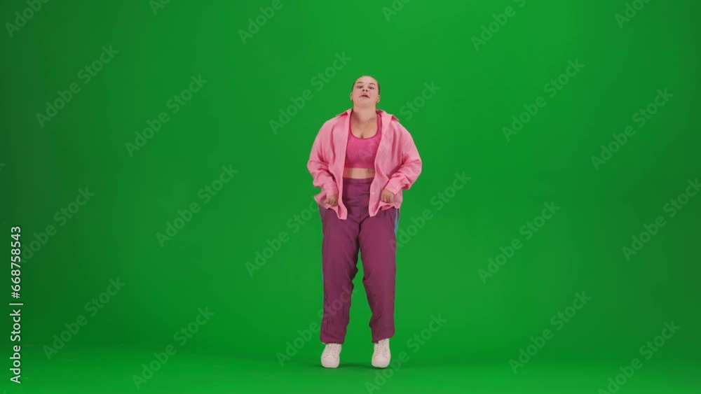 Attractive woman dancing jazz-funk on green screen chroma key background in a studio. Modern dynamic and energetic dance choreography. Full length. Attractive woman dancing jazz-funk on green screen chroma key background in a studio. Modern dynamic and energetic dance choreography. Full length.