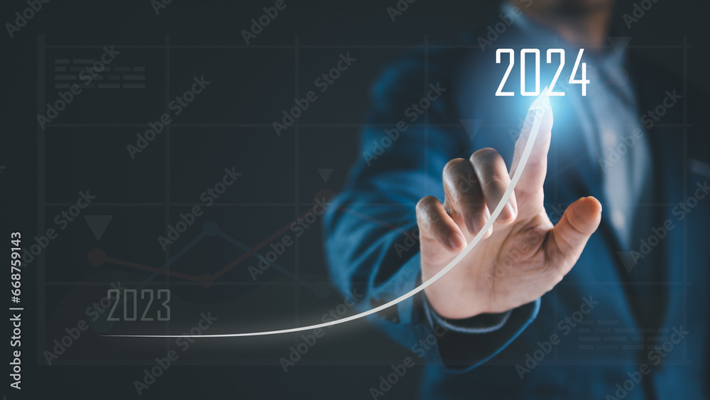 Strategic Financial Business Growth: 2024 Vision for Success, Analysis, and Revenue Increase. Businessman's hand touching the grow arrow on business chart, target increasing or goal of marketing trend - obrazy, fototapety, plakaty 