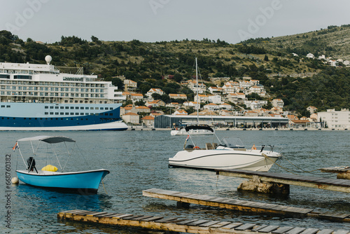 Boats in the Adriatic sea near Dubrovnik city on a sunset. Travel destination in Croatia.