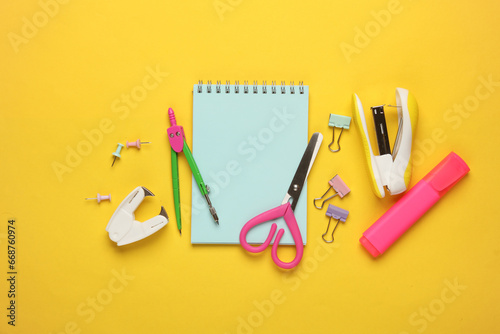 Set of school stationery on a yellow background. Fat lay. Top view