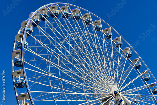 Giant Ferris Wheel ride on Pierre Lataillade Pier in the seaside resort of Arcachon, France 