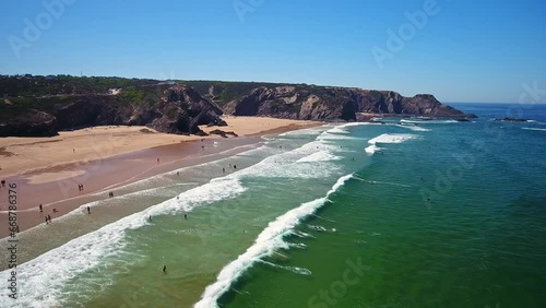 Aerial video filming by drone of sea bay and beach near village of Odeceixe Alentejo Portugal.