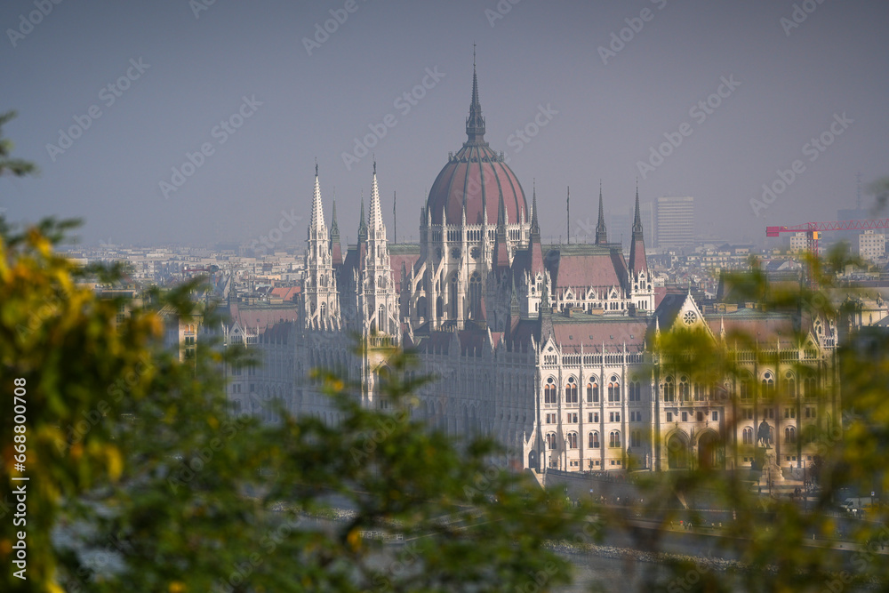 Hungarian Parliament building. View from above over the Budapest Parliament landmark construction, next to Danube river, during a foggy summer morning. Travel to Hungary.
