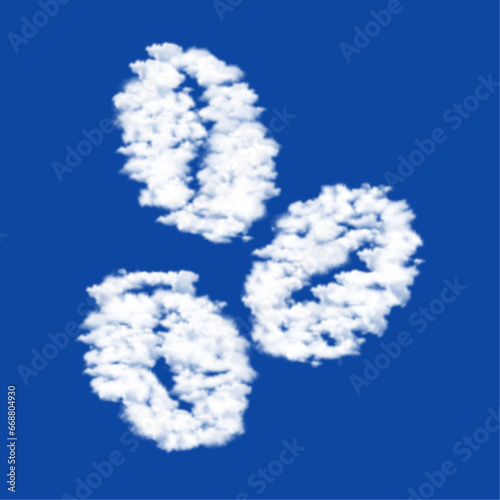 Clouds in the shape of a coffee beans symbol on a blue sky background. A symbol consisting of clouds in the center. Vector illustration on blue background